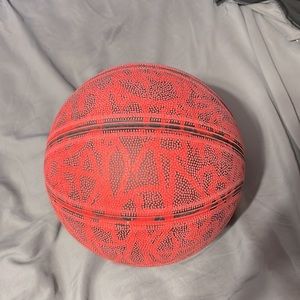 Red and black used basketball